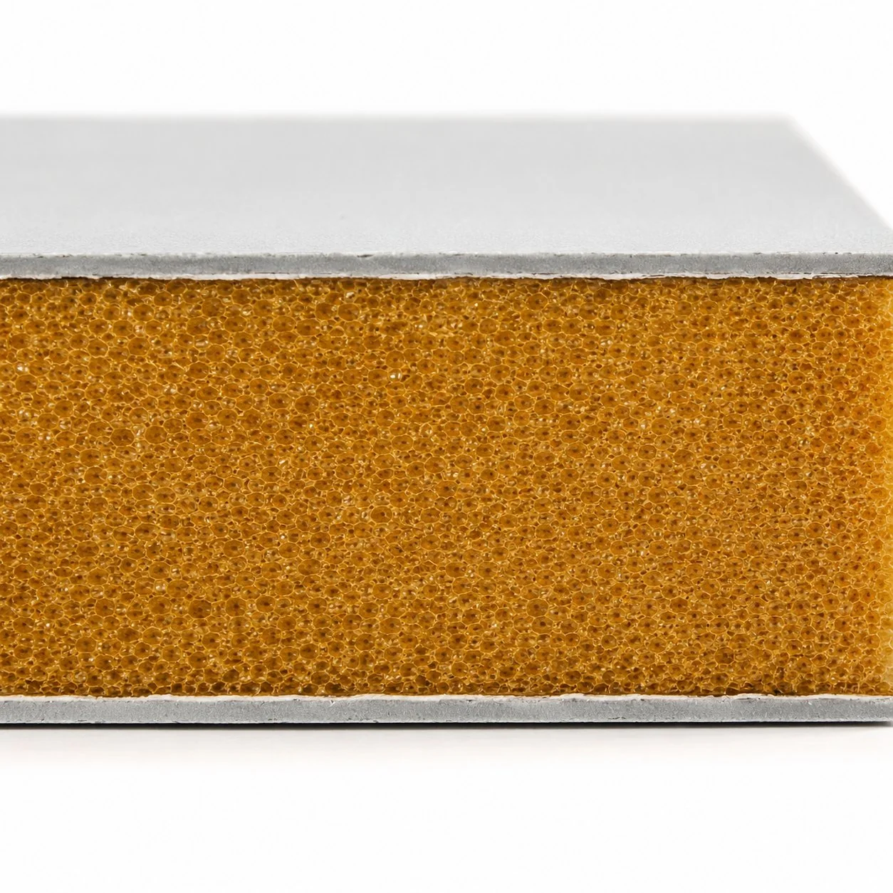 Cross-section detail of PIR facade panel showing amber polyisocyanurate foam core